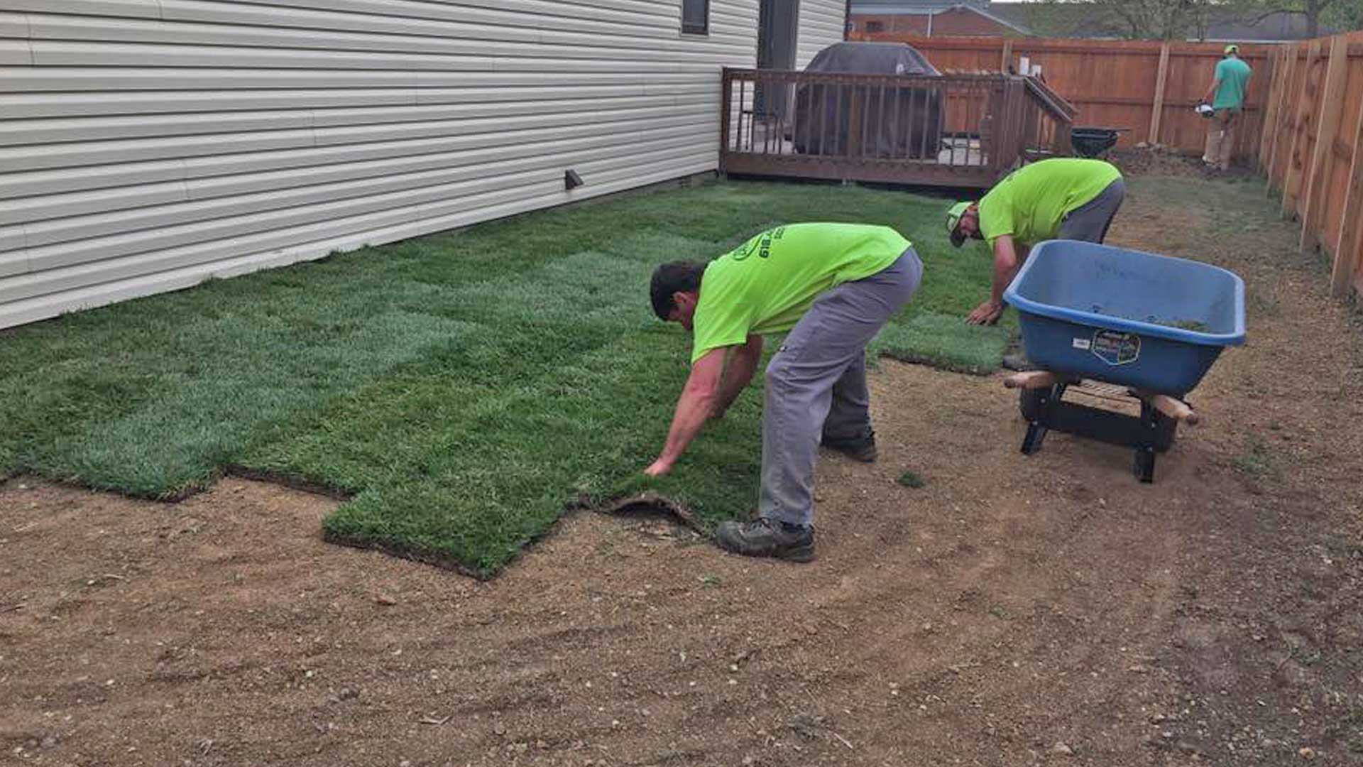 Element Turf & Outdoor Solutions, LLC employees laying new sod.