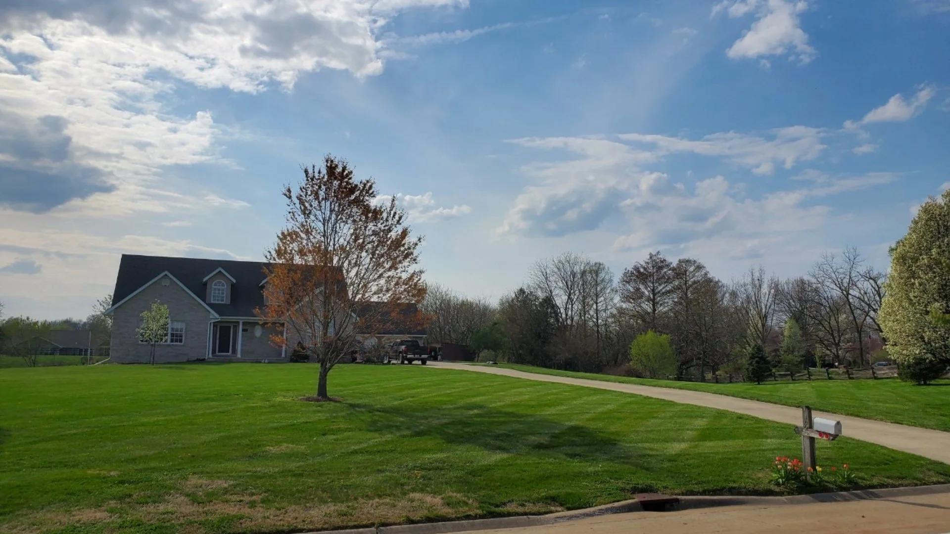 Lawn care services done on a home in South Roxana, IL.