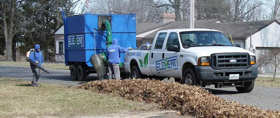 Clearing leaves and debris with vacuum truck in Godfrey, IL.