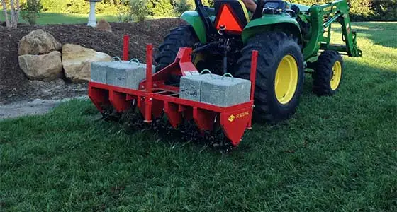 Core aeration equipment being used in Edwardsville, IL.